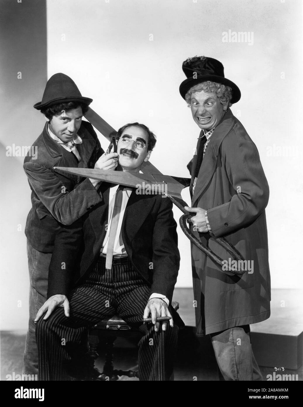 CHICO MARX GROUCHO MARX HARPO MARX The MARX BROTHERS Portrait by Clarence Sinclair Bull for A NIGHT AT THE OPERA 1935 director Sam Wood screenplay George S. Kaufman and Morrie Ryskind producer Irving Thalberg Metro Goldwyn Mayer Stock Photo