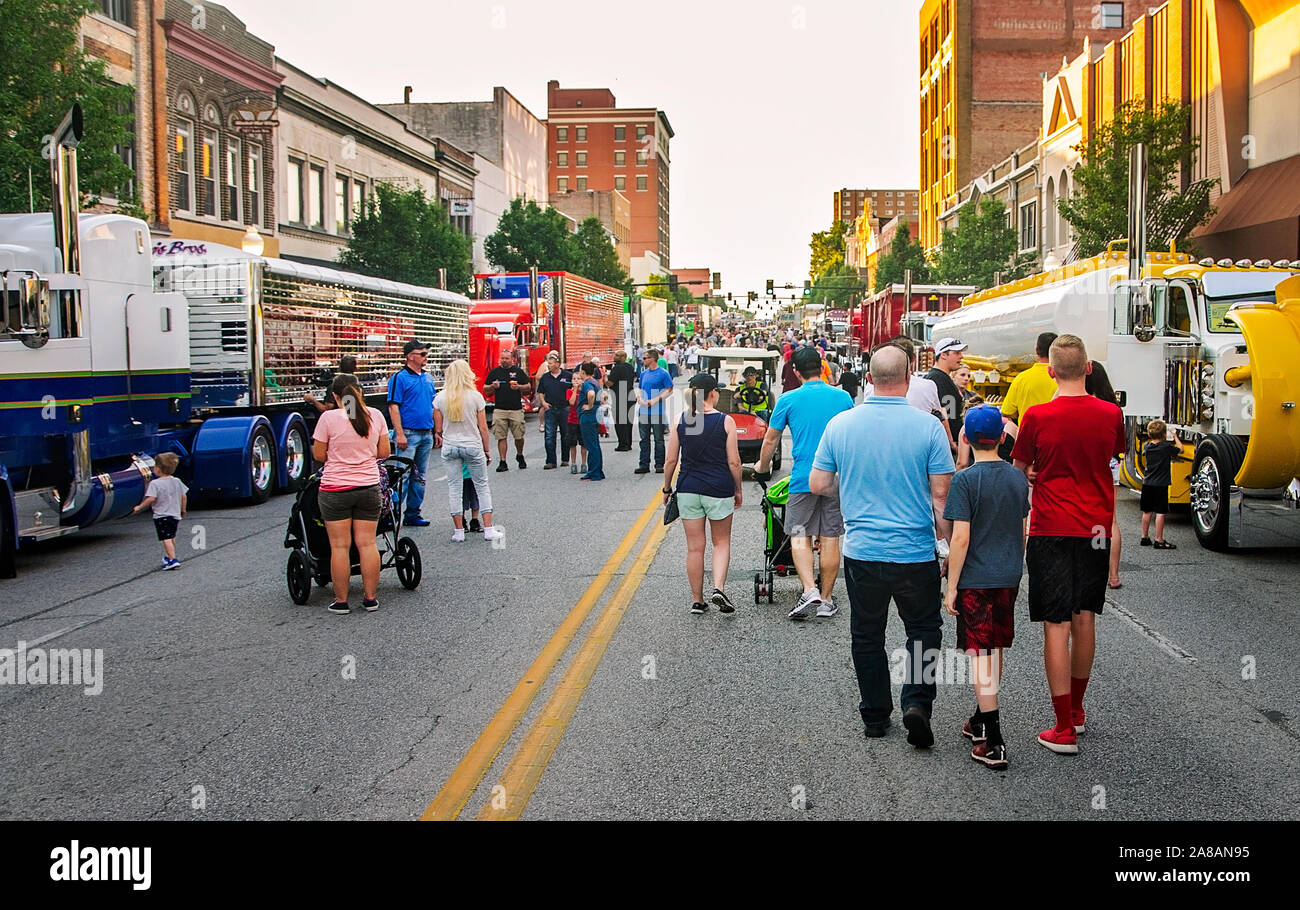 A crowd of people inspects big rigs on Main Street during the 34th annual Shell Rotella SuperRigs, June 10, 2016, in Joplin, Missouri. Stock Photo