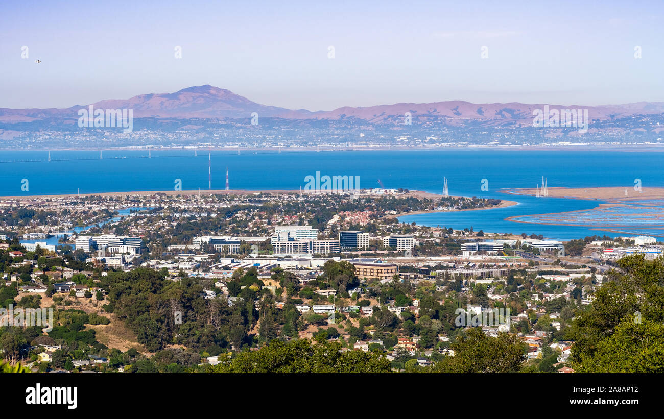 Aerial view of San Carlos and Redwood Shores; East Bay and Mount Diablo in the background; houses visible on the hills and close to the shoreline; off Stock Photo