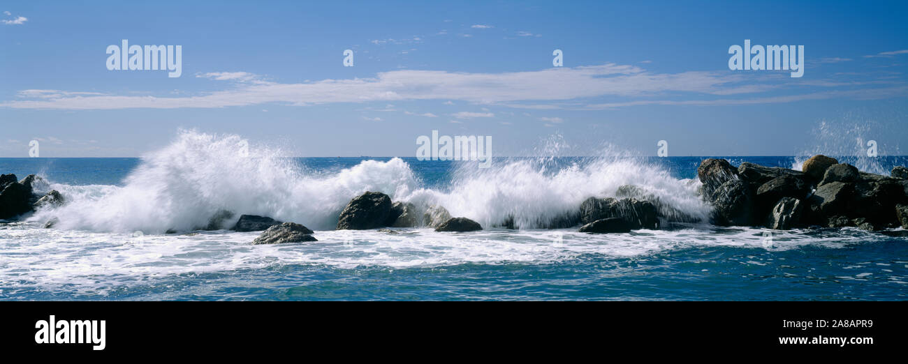 Waves breaking on rocks, Chiavari, Liguria, Italy Stock Photo