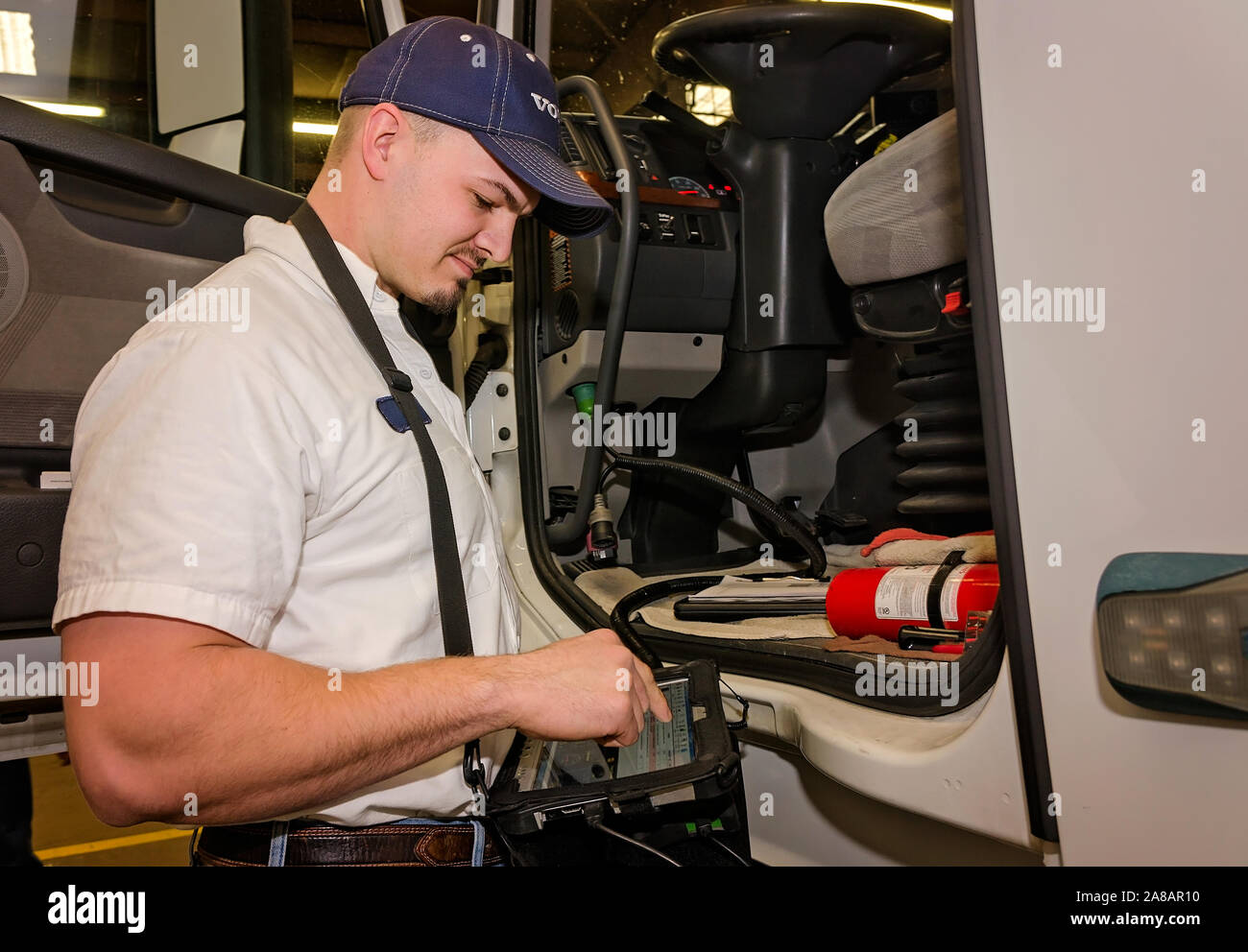 A Volvo service manager checks diagnostics on a customer’s Volvo, Nov. 15, 2017, at Bruckner Truck Sales in Farmington, New Mexico. Stock Photo