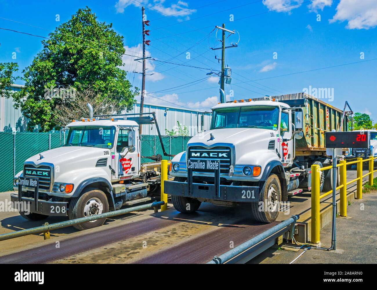 Mack trucks are lined up to be weighed at Carolina Waste & Recycling
