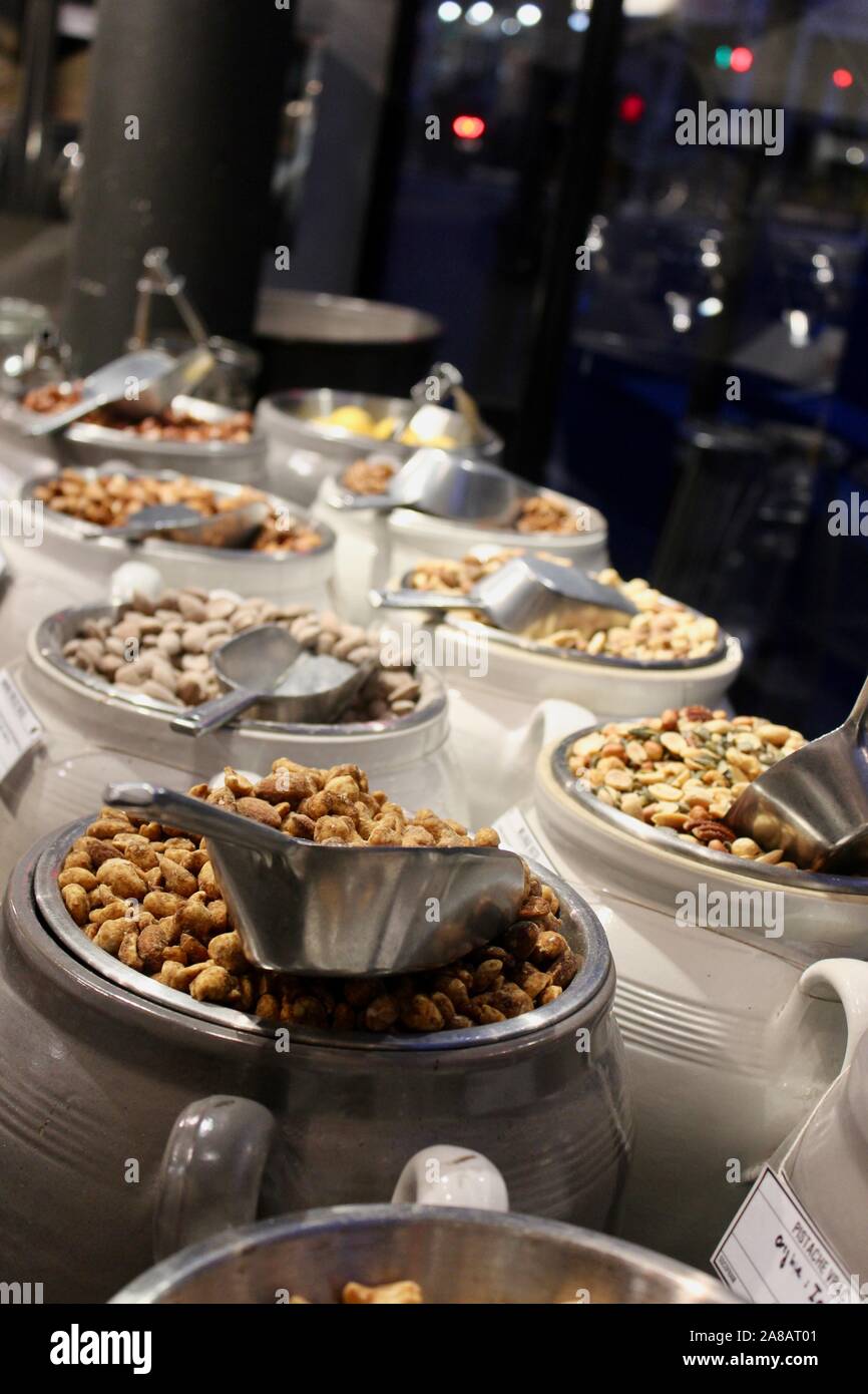 rows of nuts in self serve jars in paris france Stock Photo Alamy