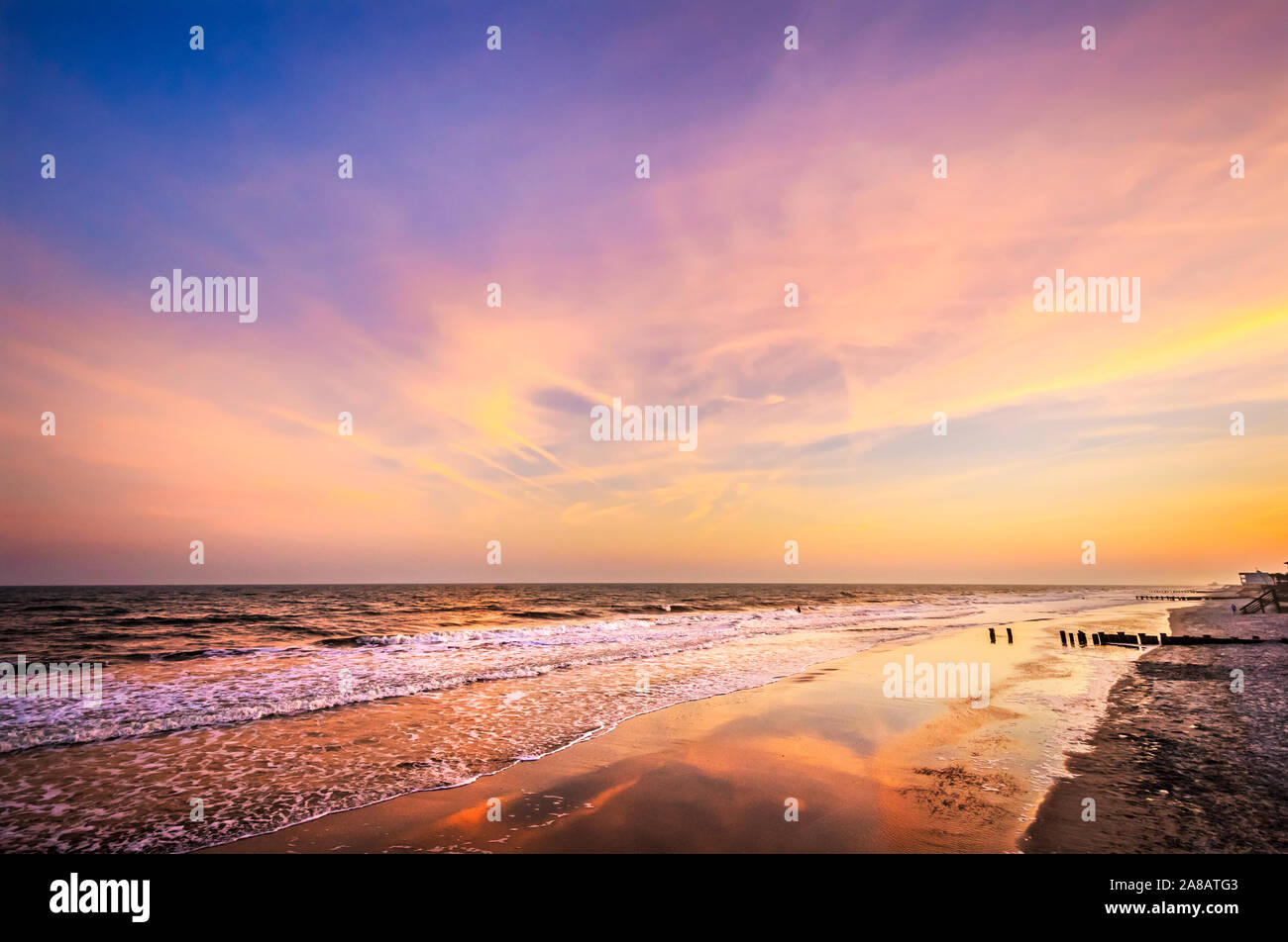 The sun sets at the Washout on Folly Beach, April 3, 2015, in Folly Beach, South Carolina. The beach is known for its prime surfing spots. Stock Photo