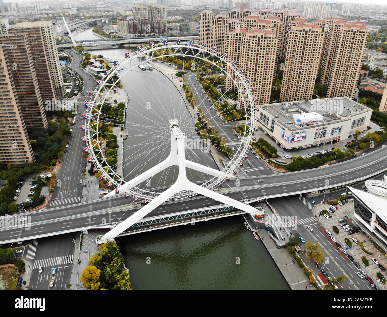 Aerial view cityscape of Tianjin ferris wheel. Famous Tianjin Eye ferris wheel above the Yongle