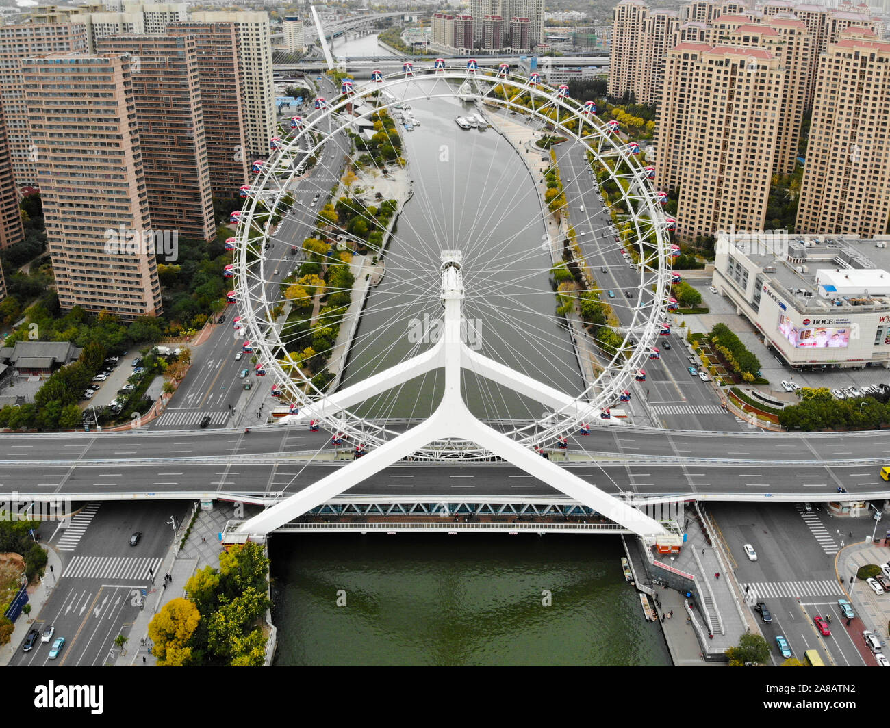 Aerial view cityscape of Tianjin ferris wheel. Famous Tianjin Eye ferris wheel above the Yongle