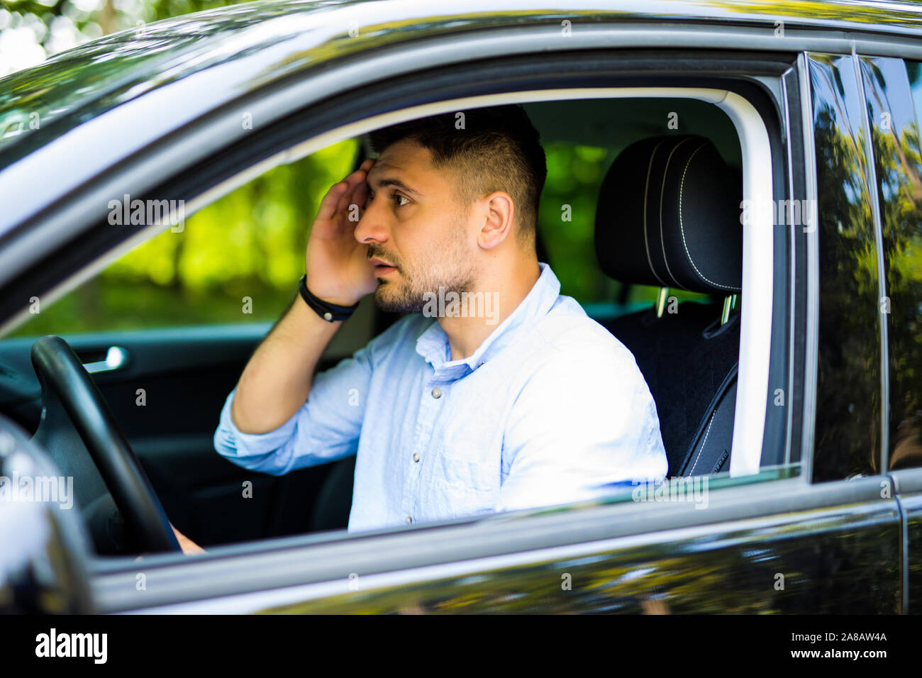 Stressed young driver man in his car Stock Photo