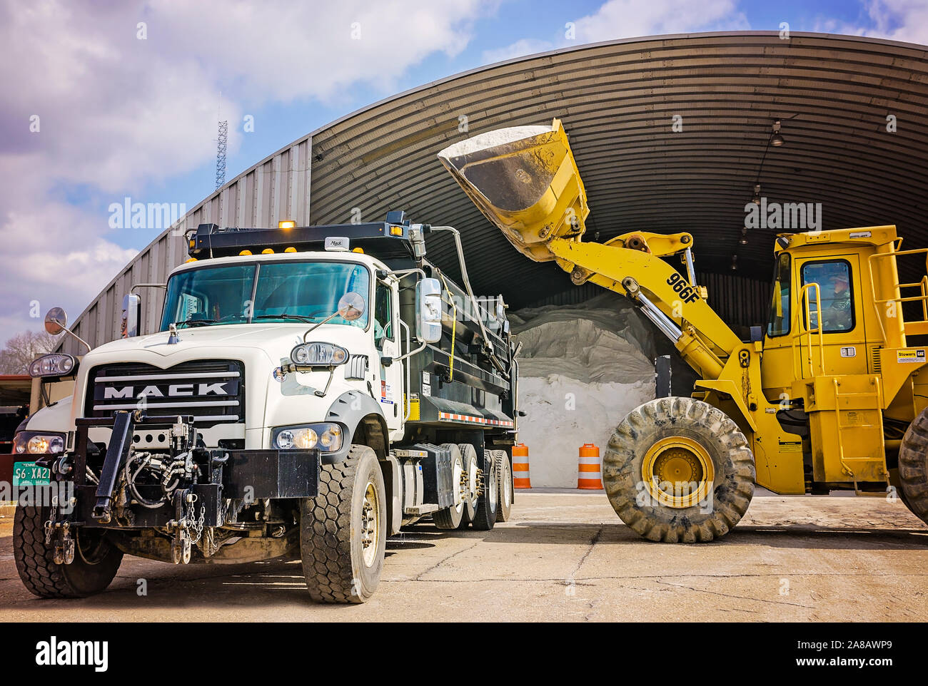 A Mack Granite is loaded with salt at the Tennessee Department of Transportation’s salt barns, March 13, 2018, in Knoxville, Tennessee. Stock Photo