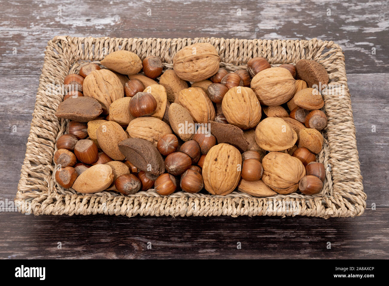Mixed nuts in a basket Stock Photo