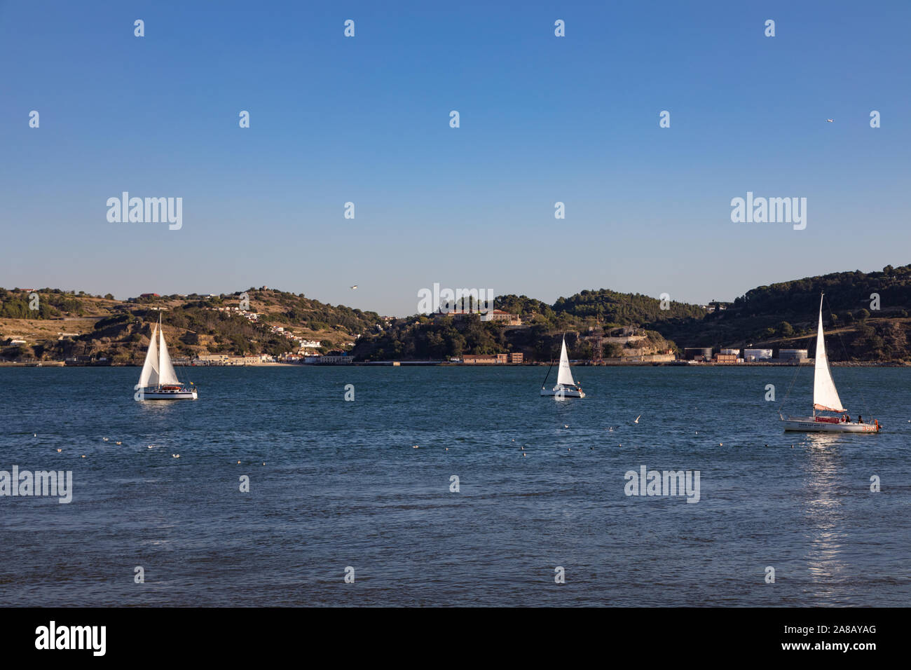 Sailboats sailing on the Tagus river, Lisbon, Portugal Stock Photo