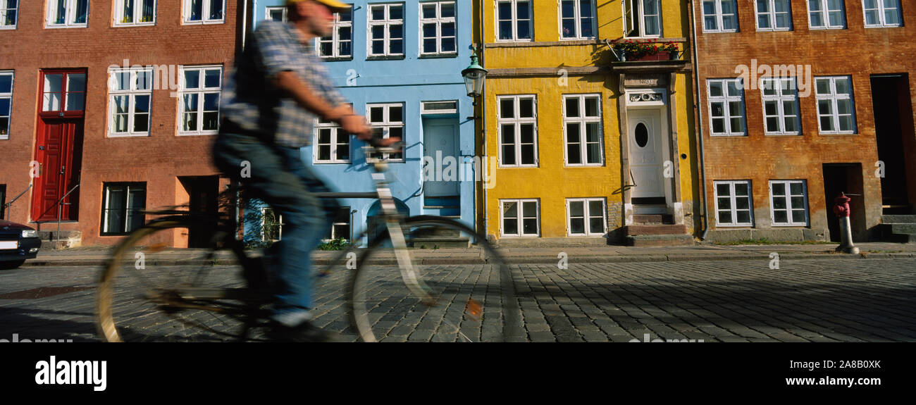 Side Profile Of A Man Riding A Bicycle, Copenhagen, Denmark Stock Photo