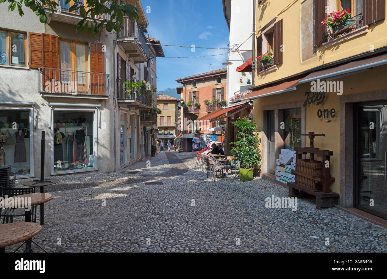 MALCESINE, ITALY - JUNE 13, 2019: The little square of the old town on the waterfront of Lago di Garda lake. Stock Photo