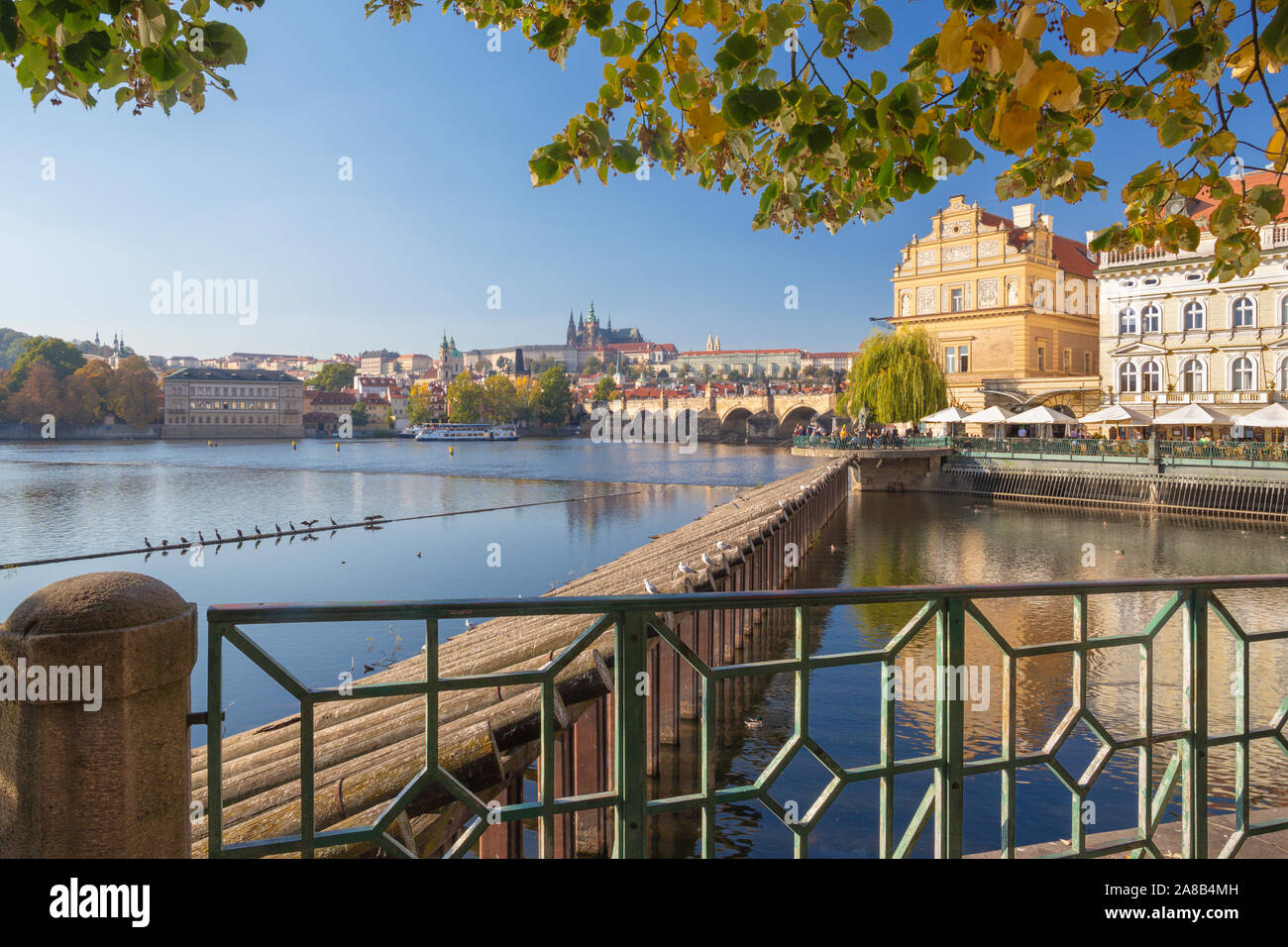 Prague-  The buildind of Bedrich Smetana museum and Charles Bridge, Castle and Cathedral in the background. Stock Photo