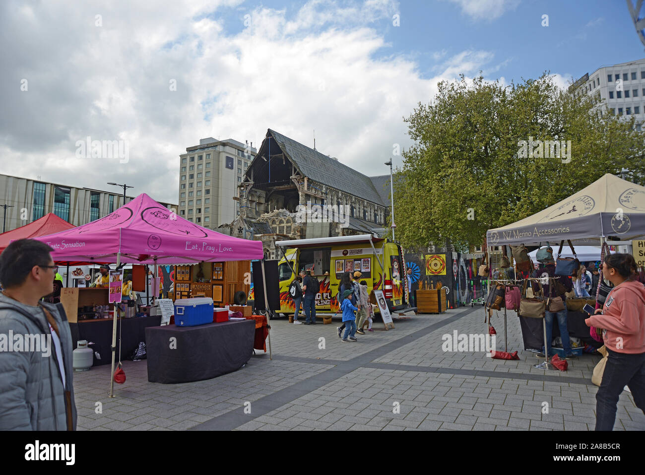 CHRISTCHURCH, NEW ZEALAND, OCTOBER 12, 2019: People mill about the CBD in  Christchurch city near the damaged Christchurch Cathedral Stock Photo