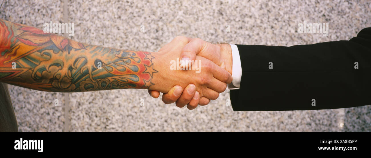 Close-up of two men shaking hands, Germany Stock Photo