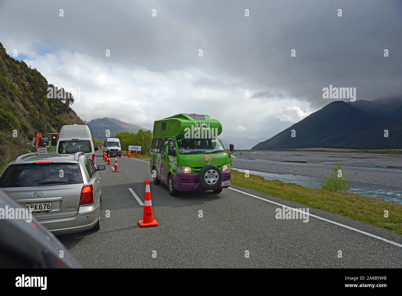 BEALEY, NEW ZEALAND, OCTOBER 12, 2019: Traffic moves on at a road works area set with traffic lights near the Waimakariri River. Stock Photo