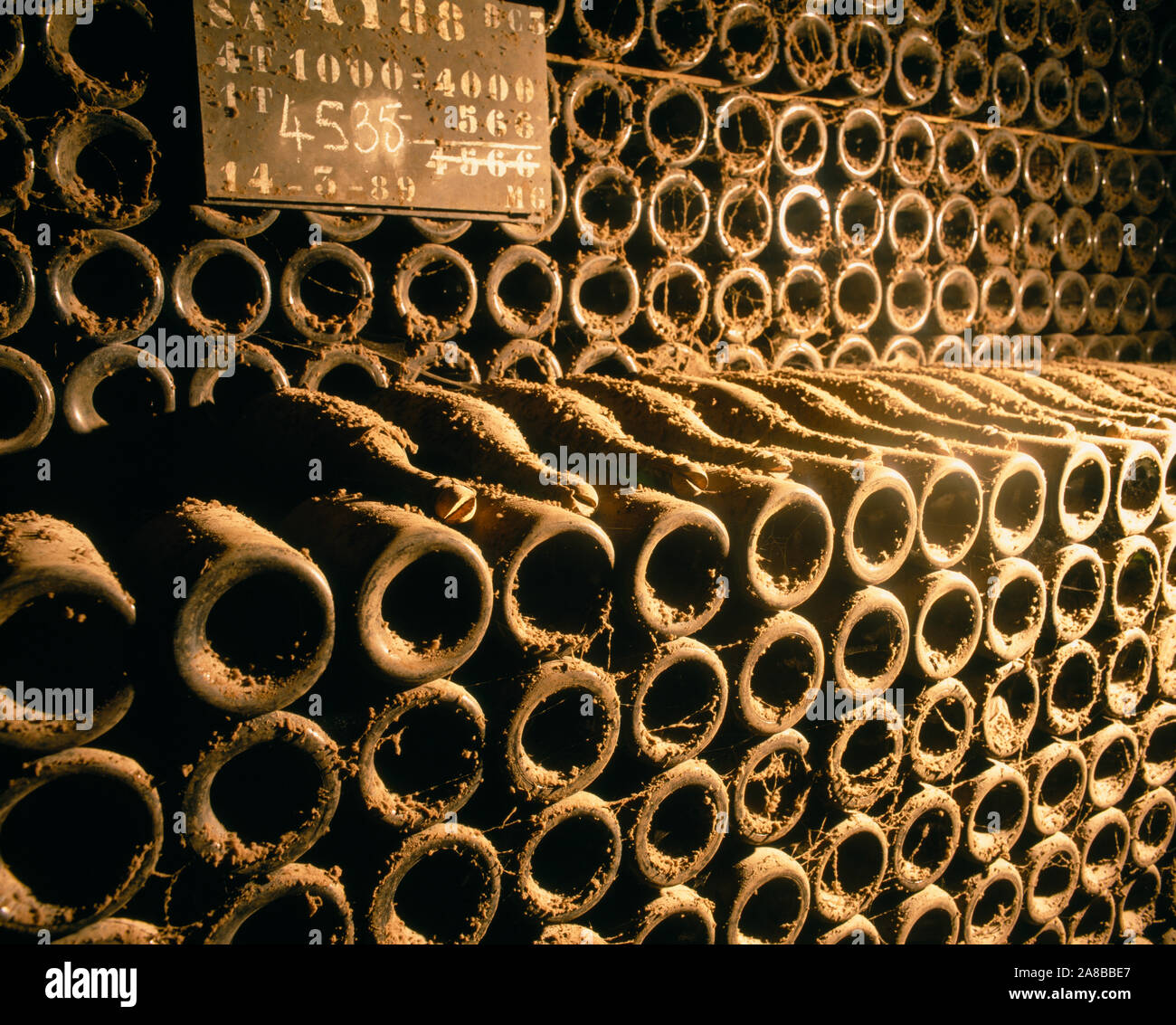 Close-up of wine bottles in a cellar of Bollinger, Ay, Champagne, France Stock Photo