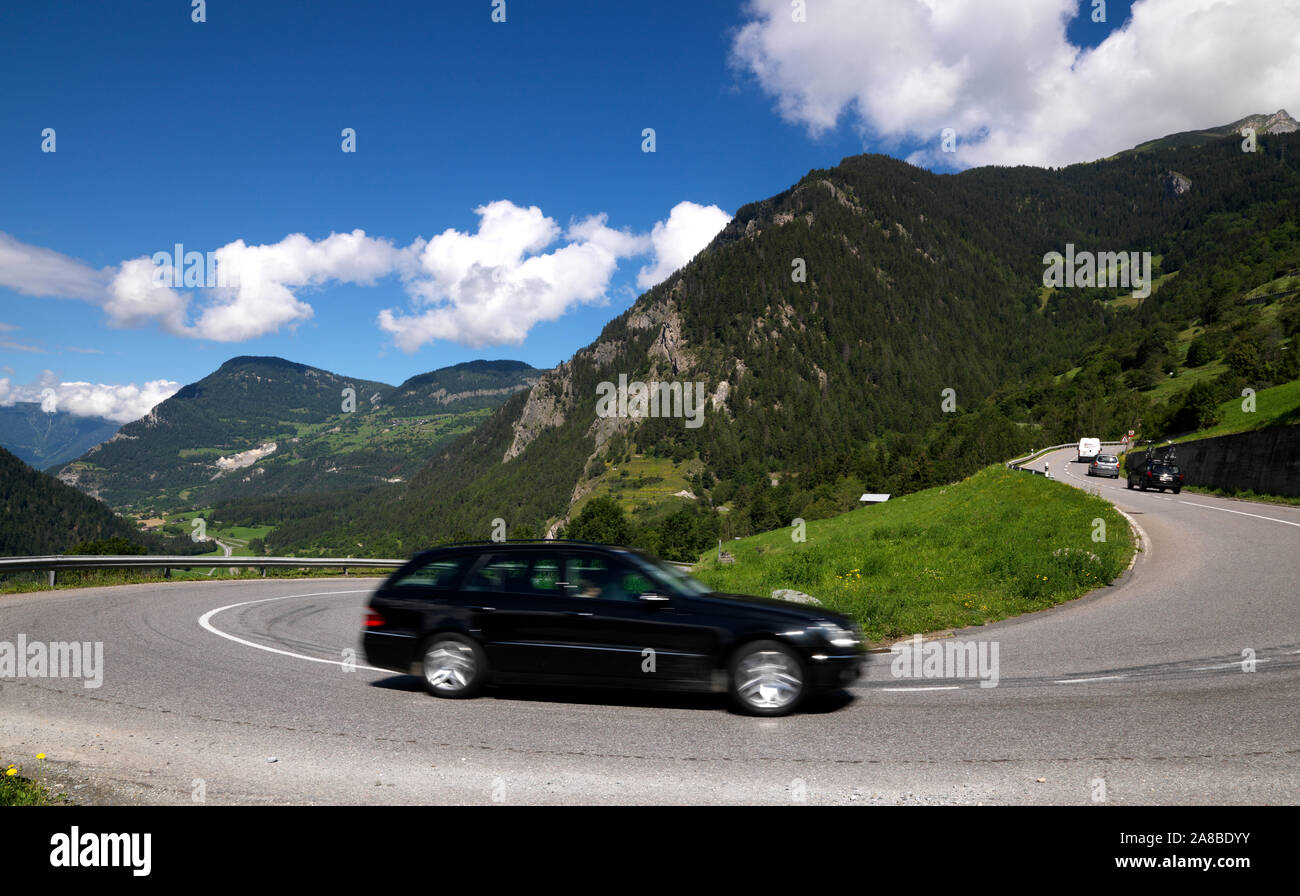 Station wagon moving on the road, Bagnes, Entremont, Valais Canton, Switzerland Stock Photo