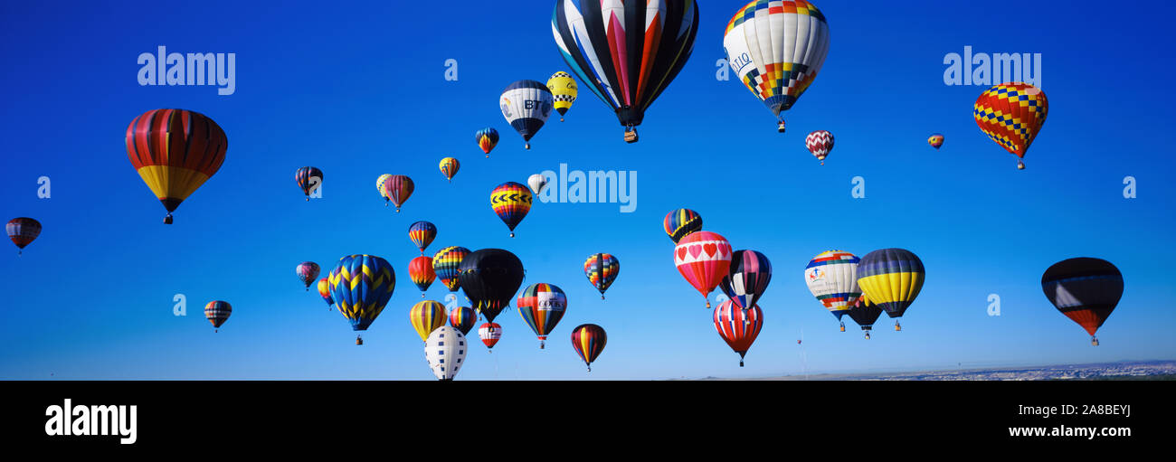 Hot air balloons floating in sky, Albuquerque International Balloon Fiesta, Albuquerque, Bernalillo County, New Mexico, USA Stock Photo