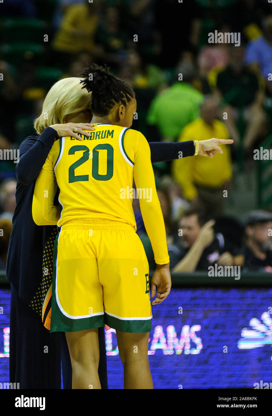 Waco, Texas, USA. 5th Nov, 2019. Baylor Lady Bears head coach Kim Mulkey talks with Baylor Lady Bears guard Juicy Landrum (20) during the 1st half of the NCAA Women's Basketball game between New Hampshire Wildcats and the Baylor Bears at The Ferrell Center in Waco, Texas. Matthew Lynch/CSM/Alamy Live News Stock Photo