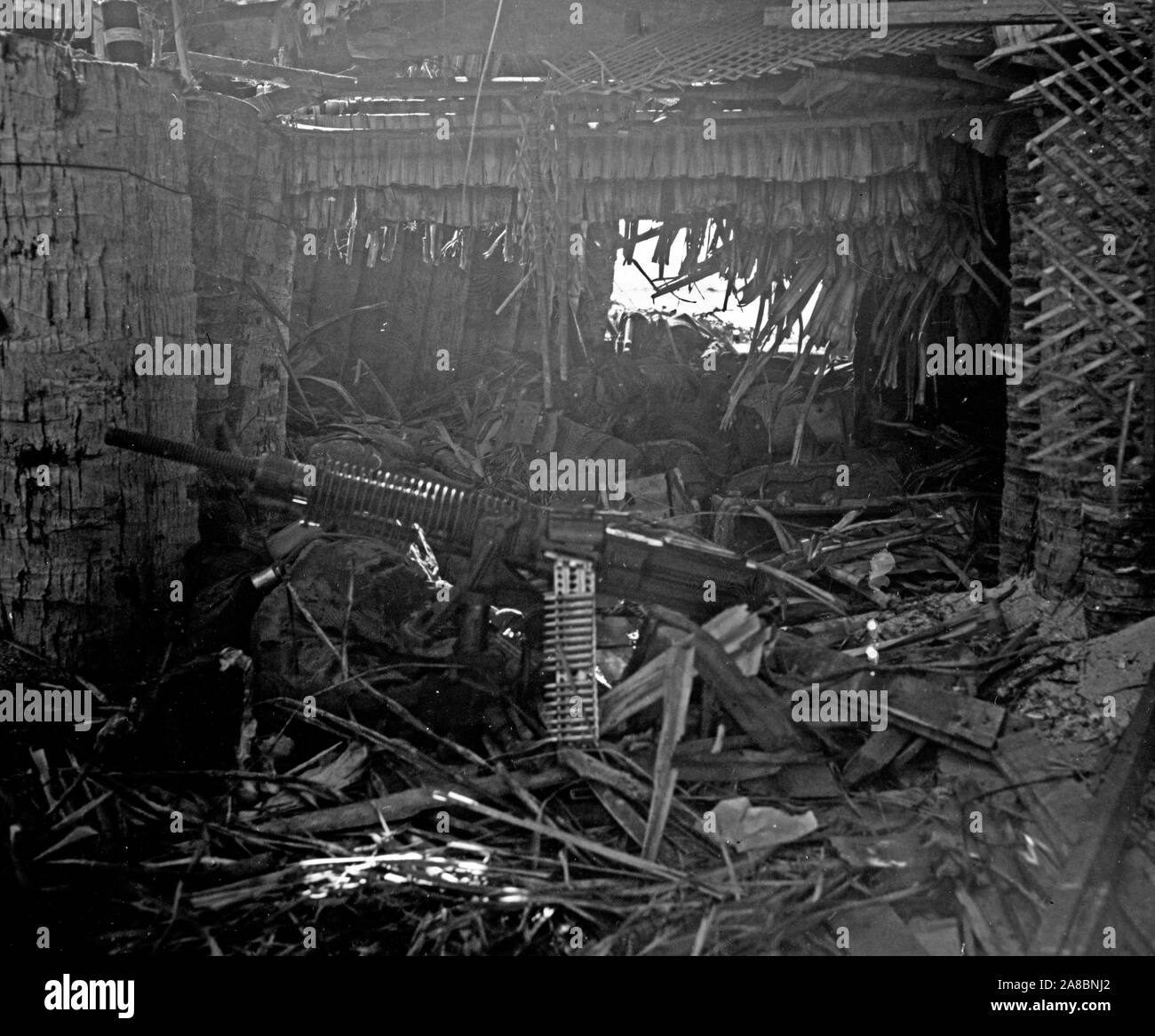 Interior of Japanese heavy machine gun pill box looking seaward through Gun port - Tarawa Stock Photo