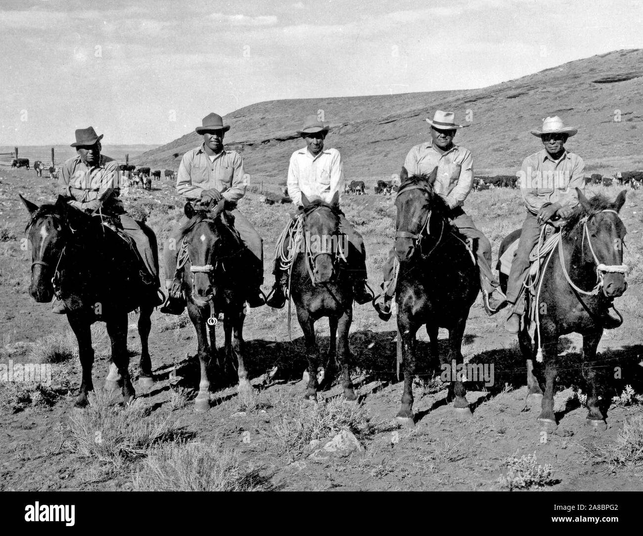five-cowboys-on-horseback-ca-1938-1947-2A8BPG2.jpg