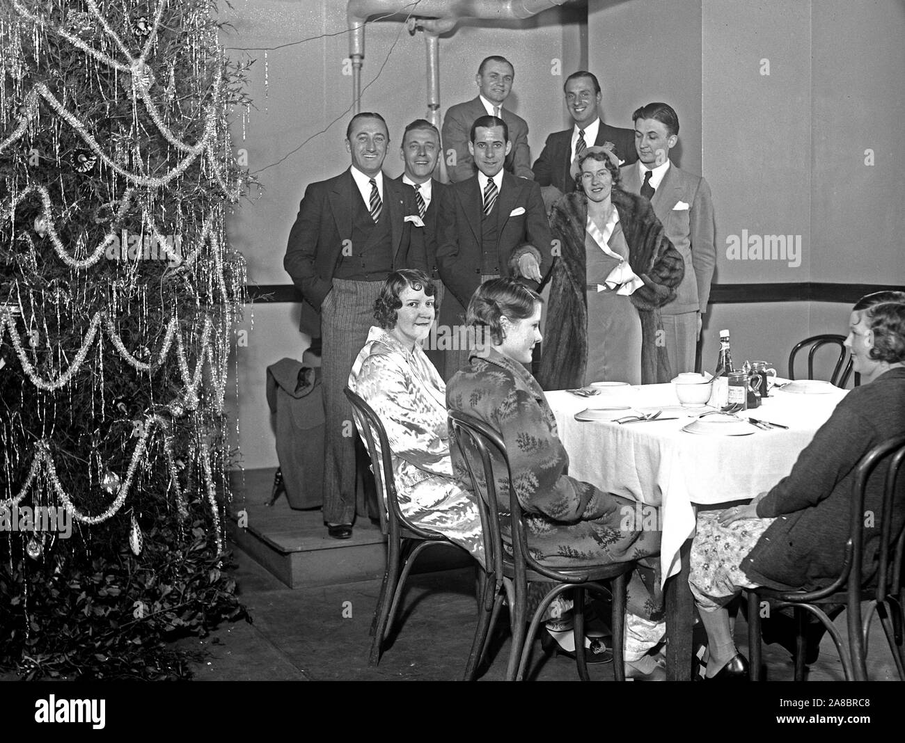 Group of people at a Chsitmas party or Christmas dinner (USA) in 1930 Stock Photo