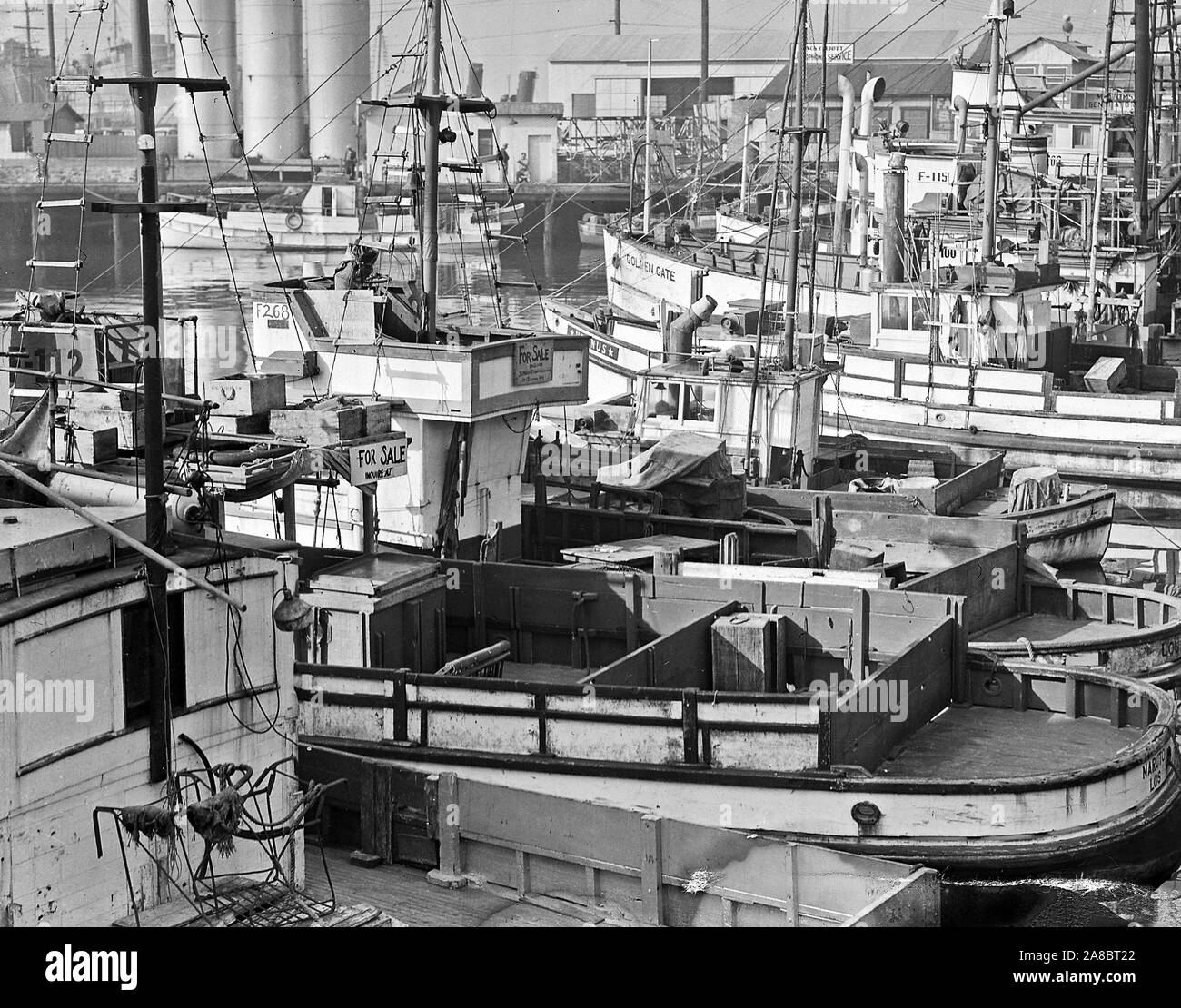 Fishing boats, formerly operated by residents of Japanese ancestry, are tied up for the duration at Terminal Island in Los Angeles harbor 4/7/1942 Stock Photo