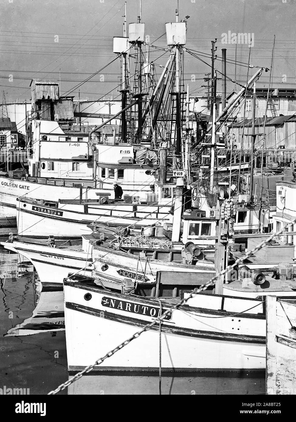 Part of the fleet of fishing boats operated by residents of Japanese ancestry before they were evacuated to assembly centers. These boats are tied up at Terminal Island in Los Angeles harbor 4/7/1942 Stock Photo