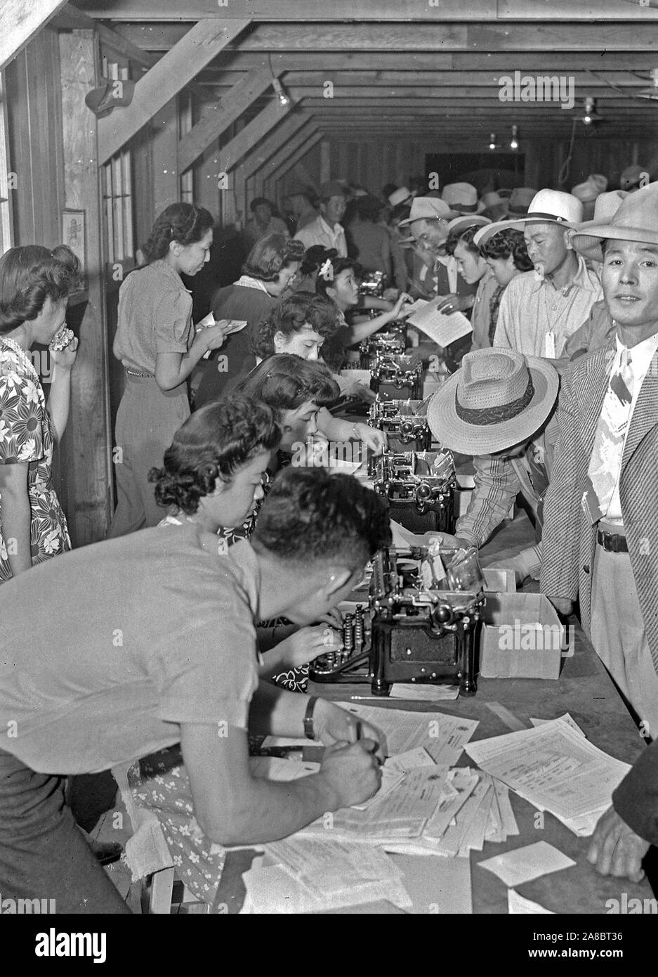 Poston, Arizona. Evacuees of Japanese ancestry are being registered upon first arrival at this War Relocation Authority center 5/10/1942 Stock Photo