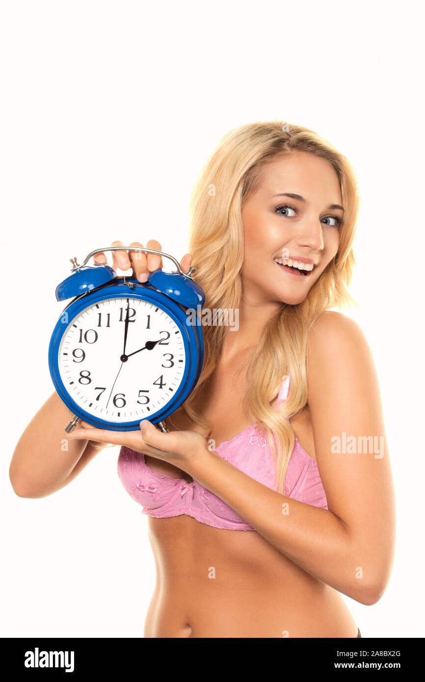 Wecker, Blonde Frau, Uhrenumstellung von Sommerzeit auf Winterzeit, MR:Yes, Stock Photo