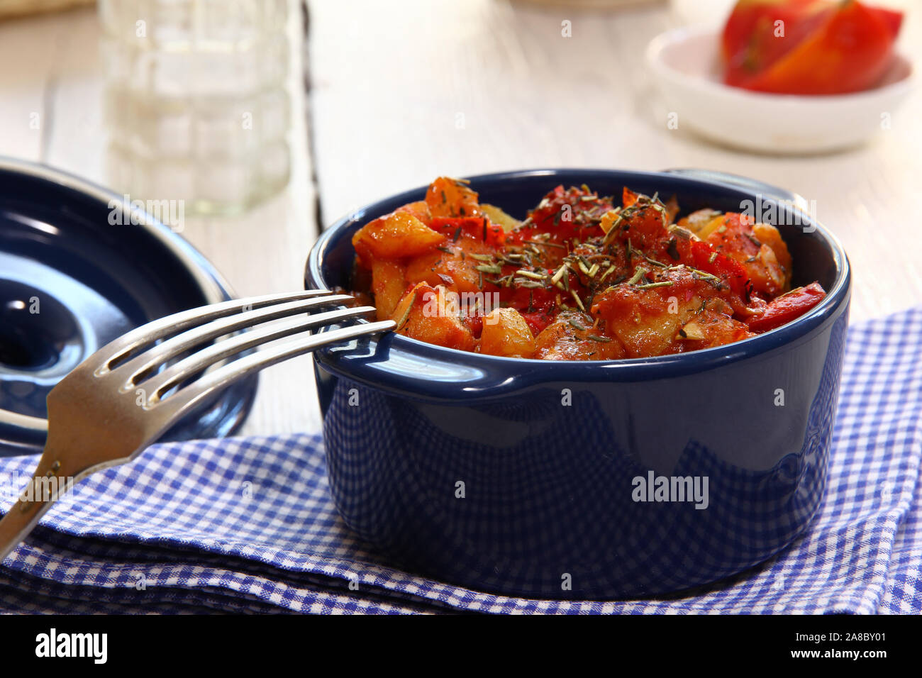 Braising vegetables in tomato sauce with dried herbs Stock Photo Alamy