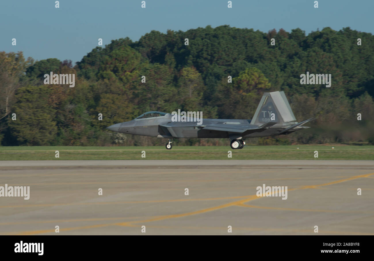 A U.S. Air Force F-22 Raptor lands after performing a series of aerial maneuvers during an F-22 Demonstration practice at the Joint Civilian Orientation Conference on Joint Base Langley-Eustis, Virginia, Nov. 7, 2019. JBLE hosted the Air Force portion of the Secretary of Defense sponsored visit. JCOC is the Department of Defense’s oldest public outreach program that enables American business and community Leaders to have a full immersive experience with their military. Stock Photo