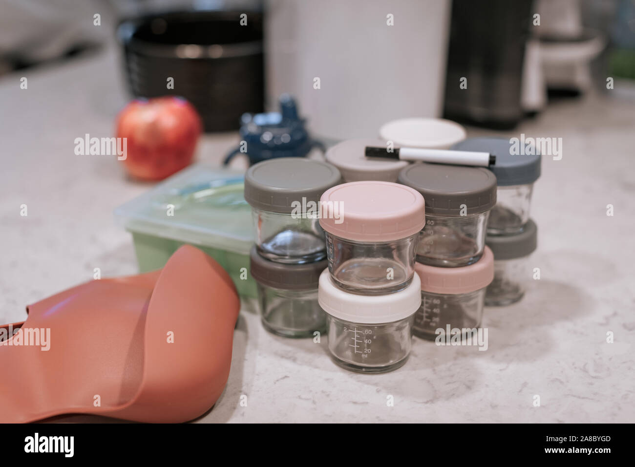 Accessories for the preparation of the first solid baby foods in the kitchen table Stock Photo