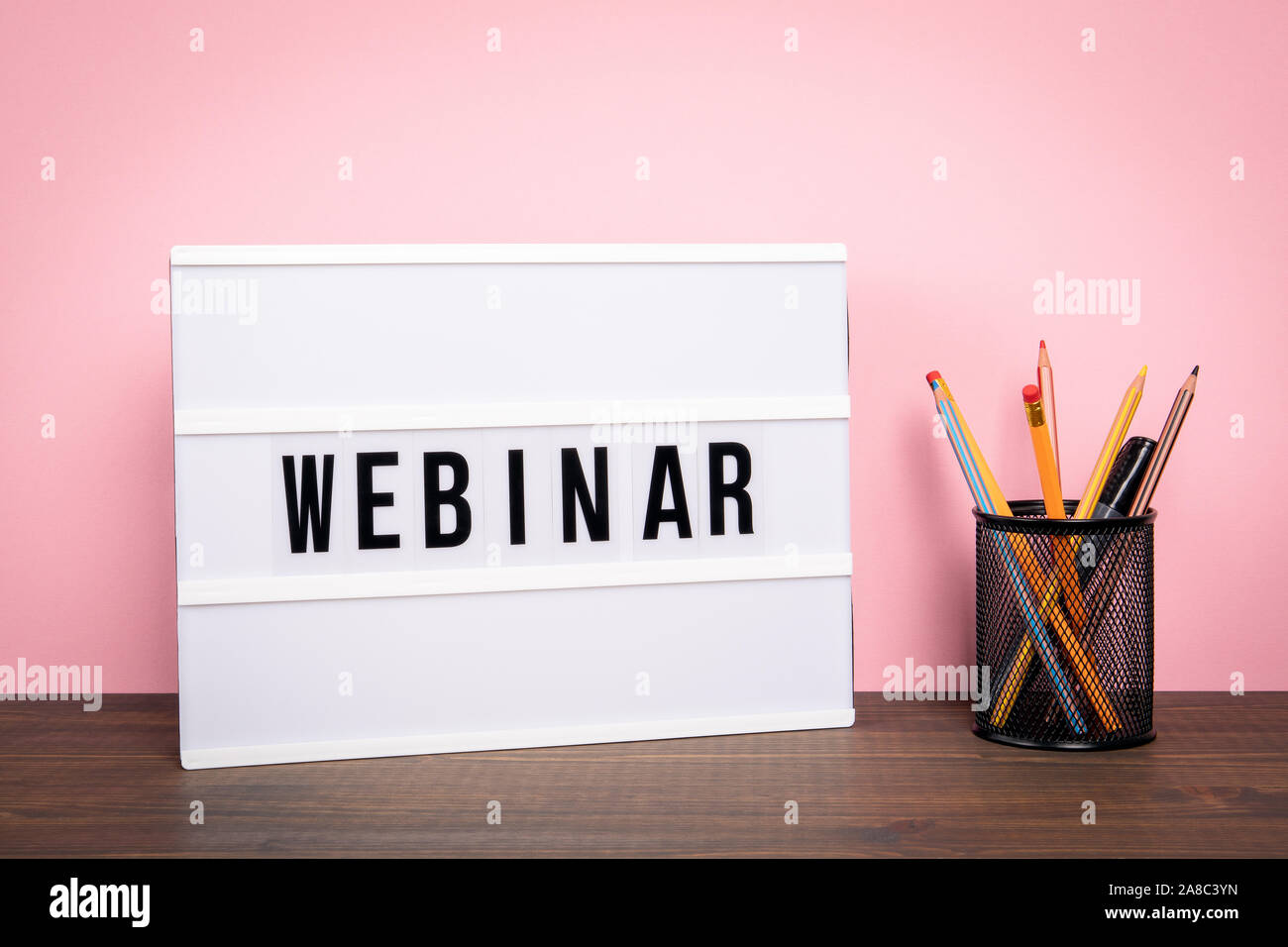 Webinar. E-learning, training, business and internet technology concept. White lightbox on a wooden table Stock Photo