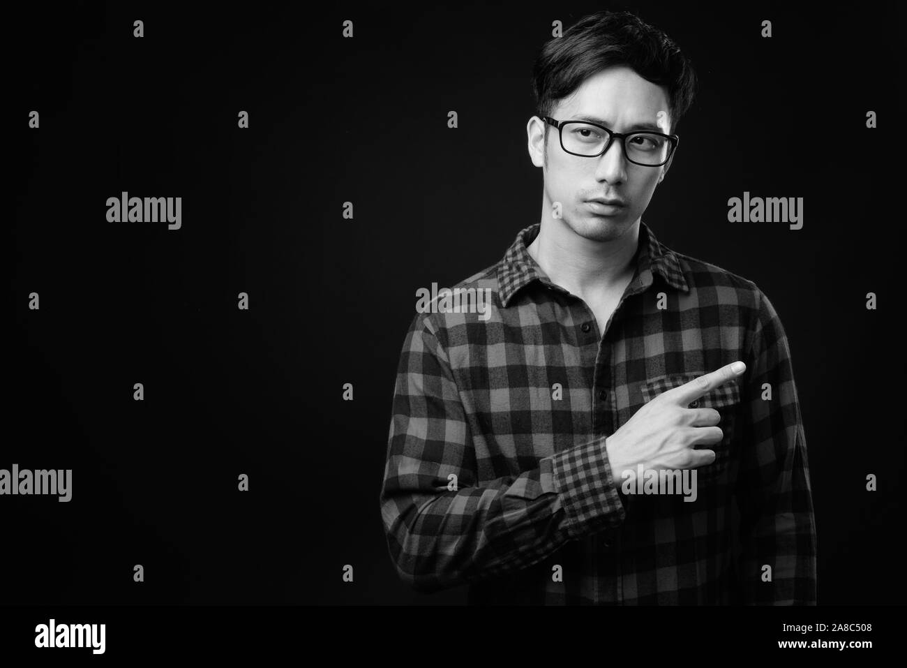 Pointing black background Black and White Stock Photos & Images - Alamy