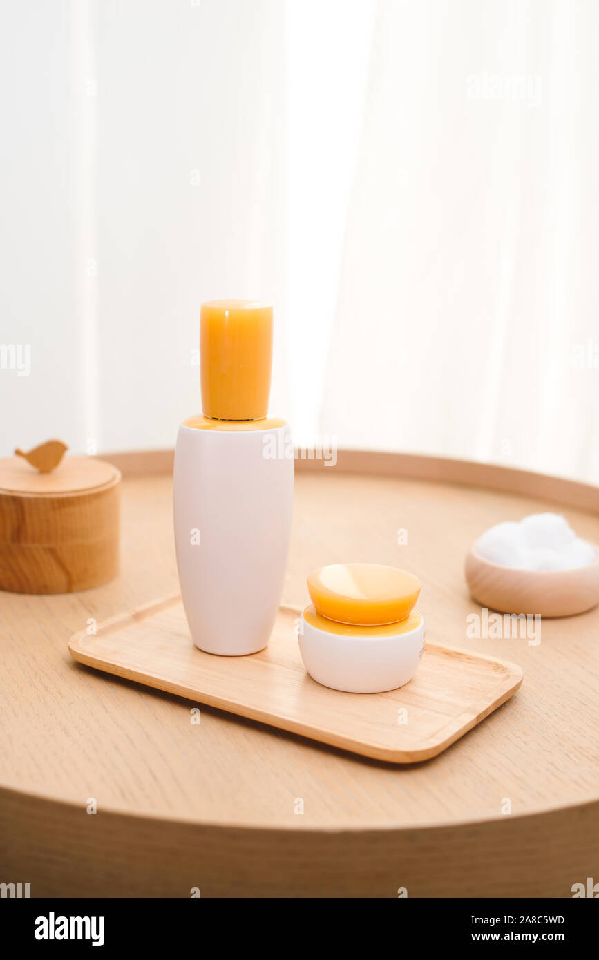 Cosmetic bottle containers on white wooden table top view flat laye. Blank label for branding mock-up Natural beauty product concept Shower Gel Soap C Stock Photo