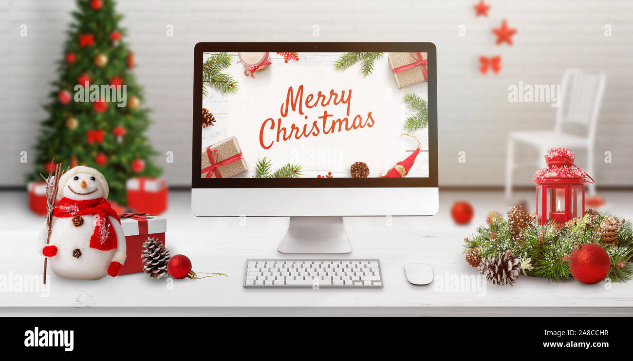 Merry Christmas greeting card with modern computer display and ...