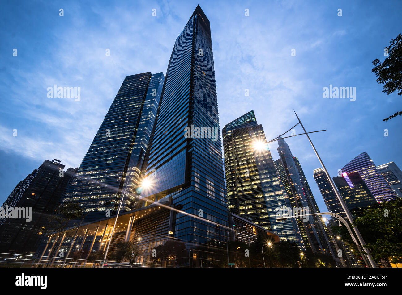 Dramatic view of modern skyscrapers in the Singapore business district at nightfall in Singapore, Southeast Asia Stock Photo