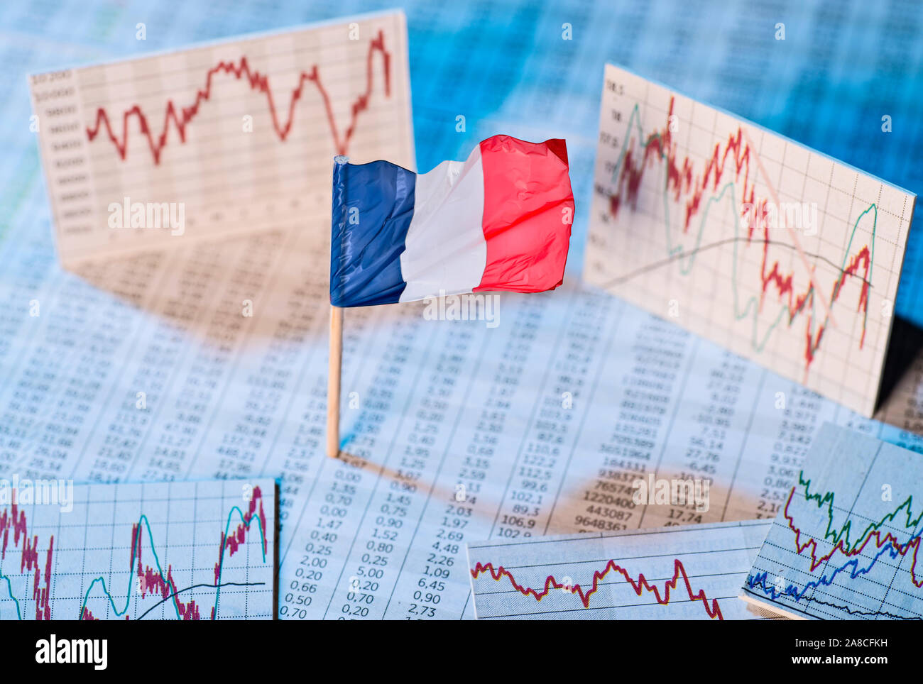 French flag with course tables and graphs on economic development Stock Photo