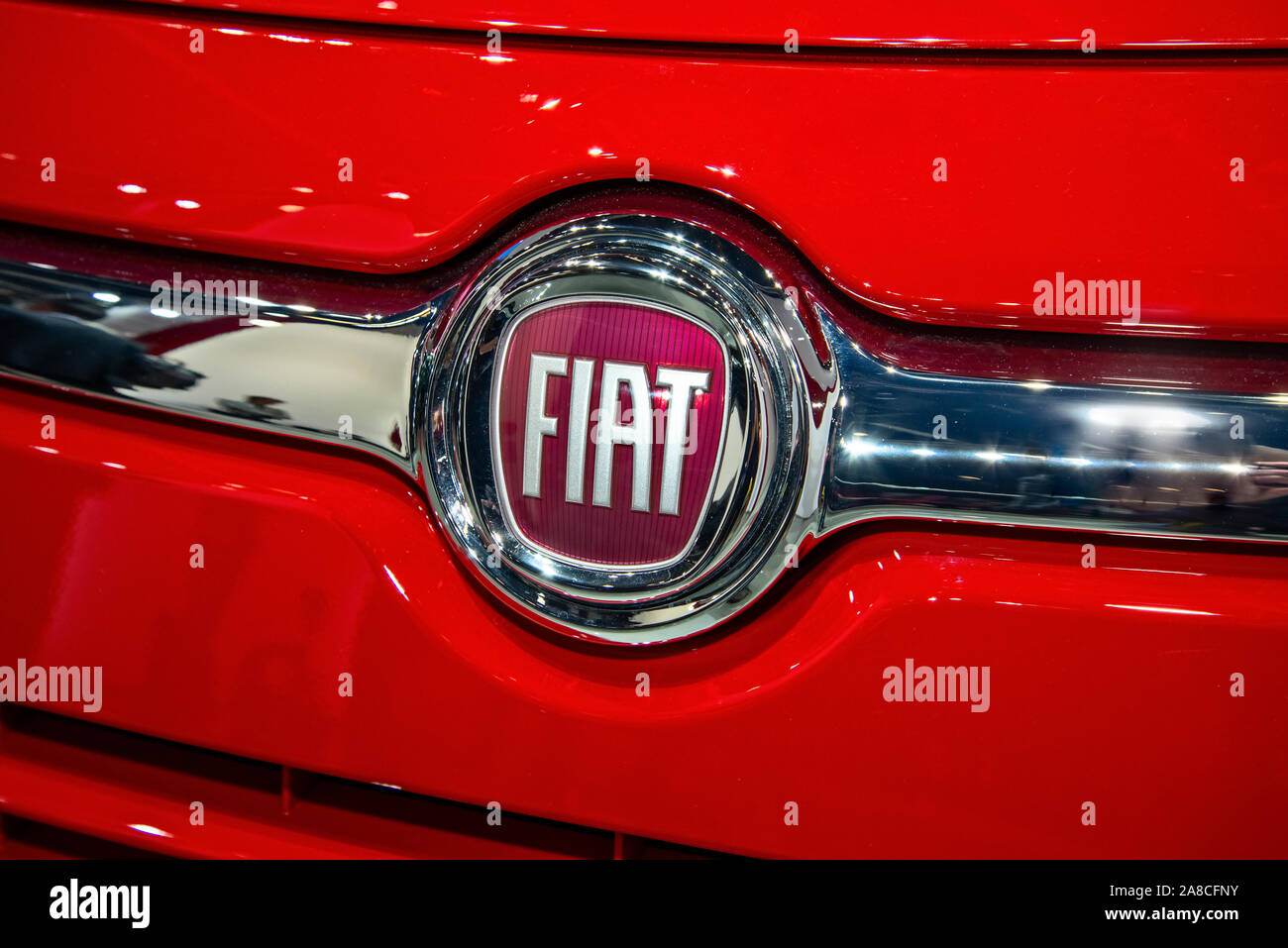 The Fiat logo on a red car of this brand Stock Photo