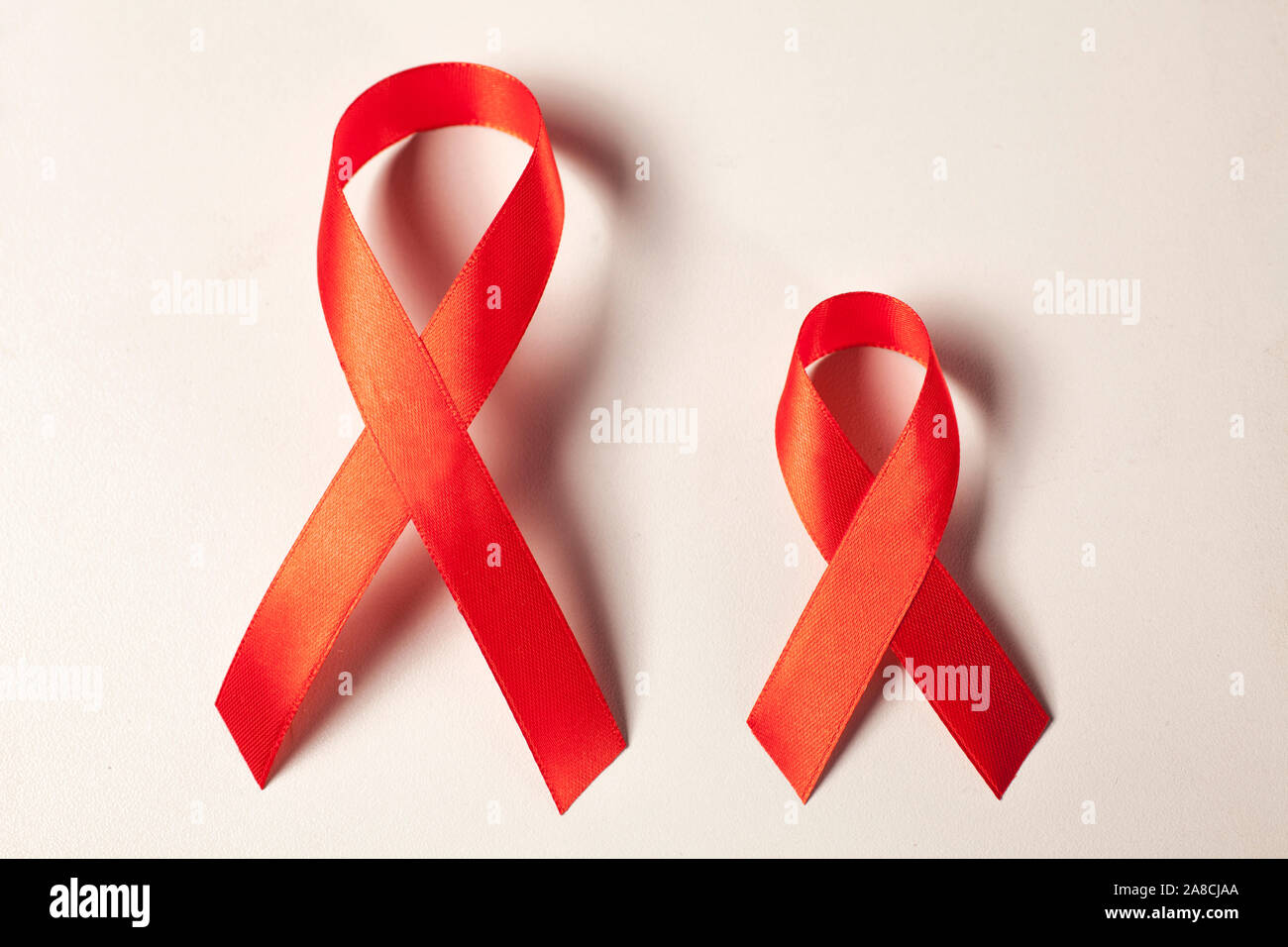 two AIDS ribbons on white Stock Photo