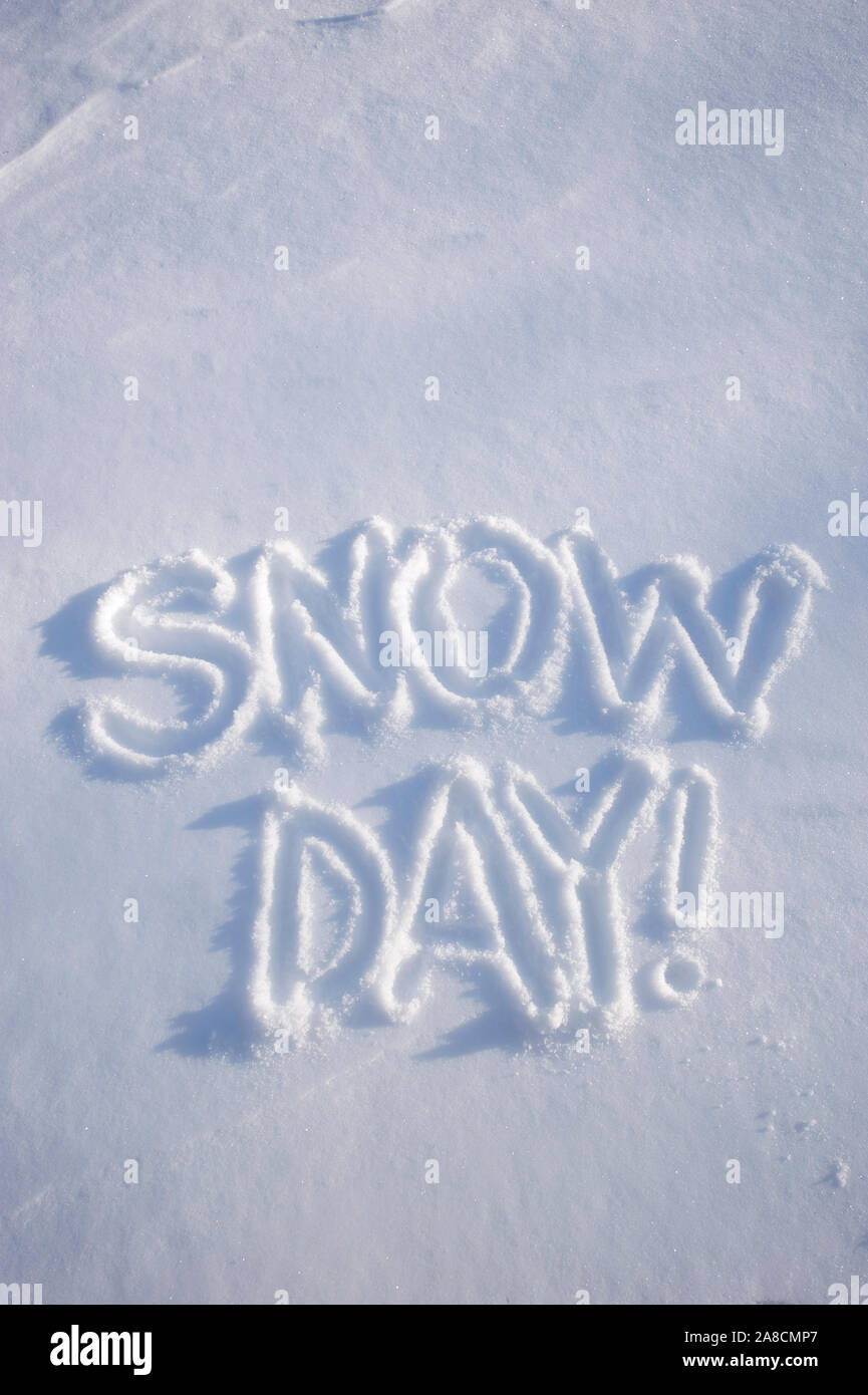 Snow Day! message handwritten in fresh white winter powder Stock Photo