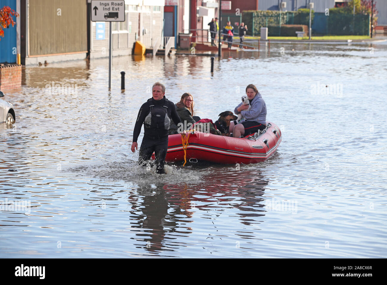 People are being taken to safety in boats on Yarborough Terrace in Doncaster, Yorkshire, as parts of England endured a month's worth of rain in 24 hours, with scores of people rescued or forced to evacuate their homes, others stranded overnight in a shopping centre, and travel plans thrown into chaos. Stock Photo