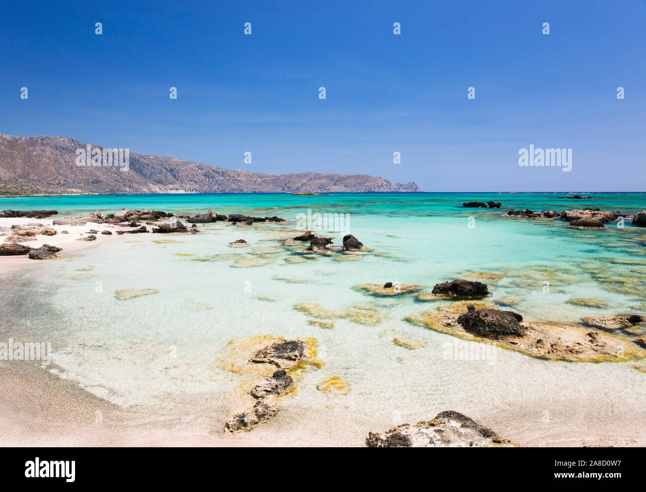 Elafonisi, Chania, Crete, Greece. View from beach across the clear turquoise waters of Vroulia Bay. Stock Photo