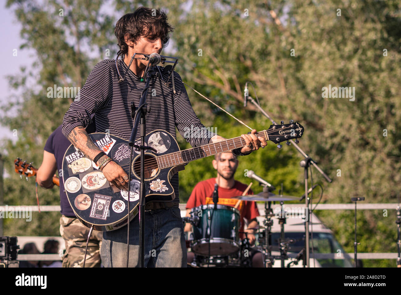 Rock singer with harmonica and guitar 2 Stock Photo Alamy