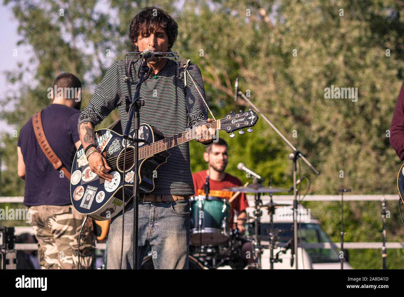 Rock singer with harmonica and guitar 3 Stock Photo Alamy