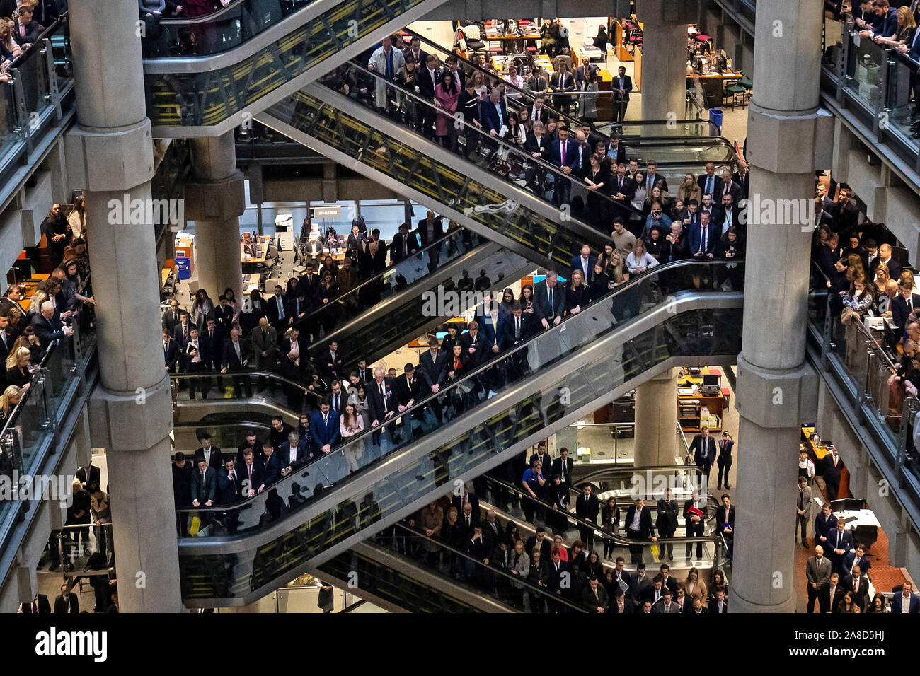 City workers at a Remembrance Day ceremony at Lloyd's of London in the City of London to mark Armistice Day, the anniversary of the end of the First World War. Stock Photo