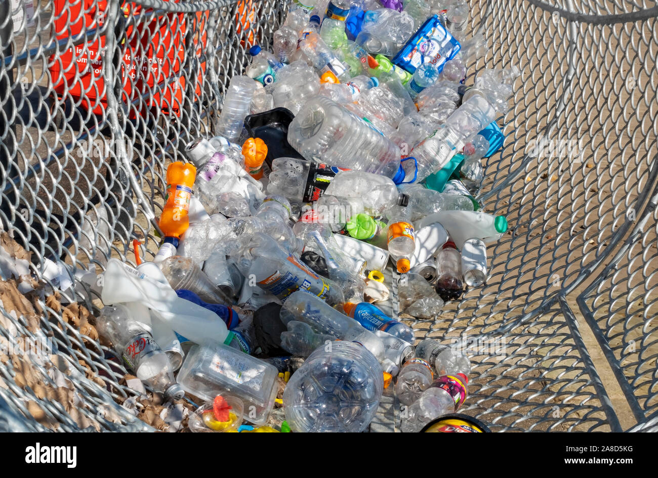 Close up of drink and food containers inside Fin the Fish a bin for plastic waste recycling on the seafront Scarborough North Yorkshire England UK Stock Photo