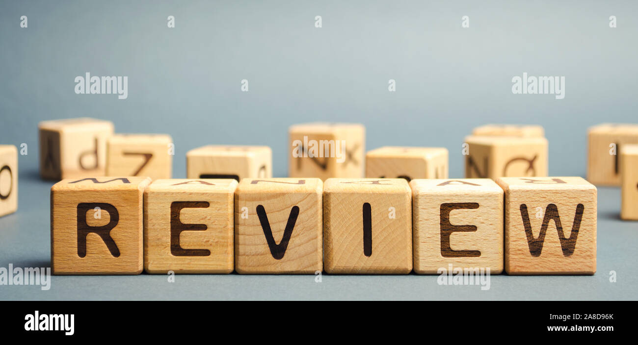 Wooden blocks with the word Review. Customer review concept. Reviewing, auditing, reviewer. Service rating. Feedback. Stock Photo